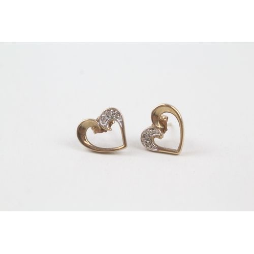 131 - 9ct gold diamond heart shape stud earrings (1.6g)