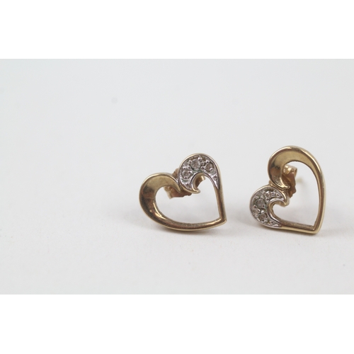 131 - 9ct gold diamond heart shape stud earrings (1.6g)