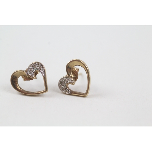 131 - 9ct gold diamond heart shape stud earrings (1.6g)