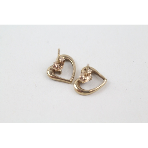 131 - 9ct gold diamond heart shape stud earrings (1.6g)