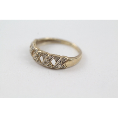 137 - 9ct gold diamond kiss design dress ring (1.8g) Size  O 1/2