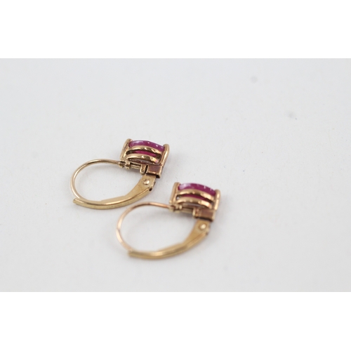 143 - 9ct gold marquise cut ruby lever back earrings (1g)