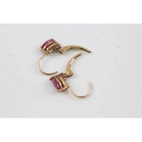 143 - 9ct gold marquise cut ruby lever back earrings (1g)