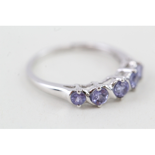 37 - 9ct gold tanzanite half eternity ring (1.6g) Size  J 1/2