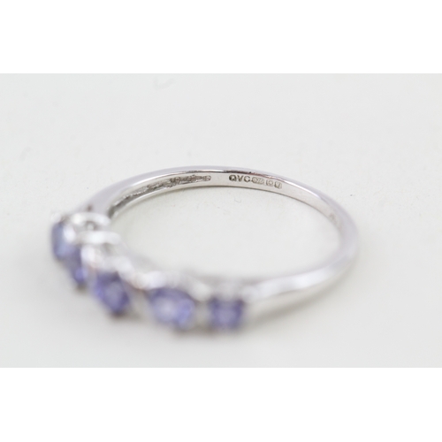 37 - 9ct gold tanzanite half eternity ring (1.6g) Size  J 1/2