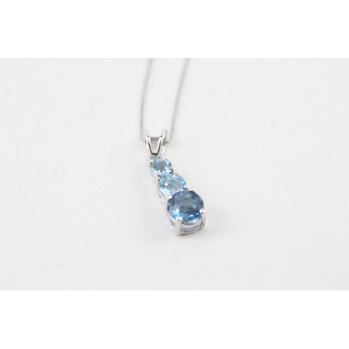 56 - 9ct gold graduated vari-hue blue topaz drop pendant necklace (1.2g)