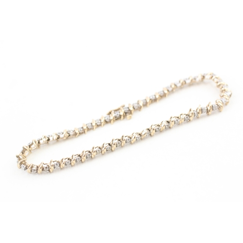 77 - 9ct gold diamond line bracelet (7.1g)