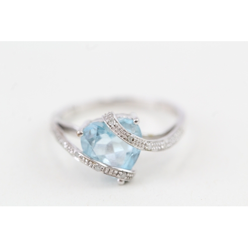 9 - 9ct gold heart shape blue topaz & diamond dress ring (2.8g) Size  P