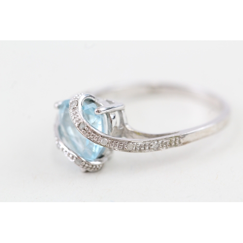 9 - 9ct gold heart shape blue topaz & diamond dress ring (2.8g) Size  P