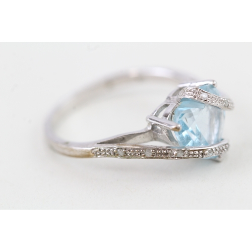 9 - 9ct gold heart shape blue topaz & diamond dress ring (2.8g) Size  P