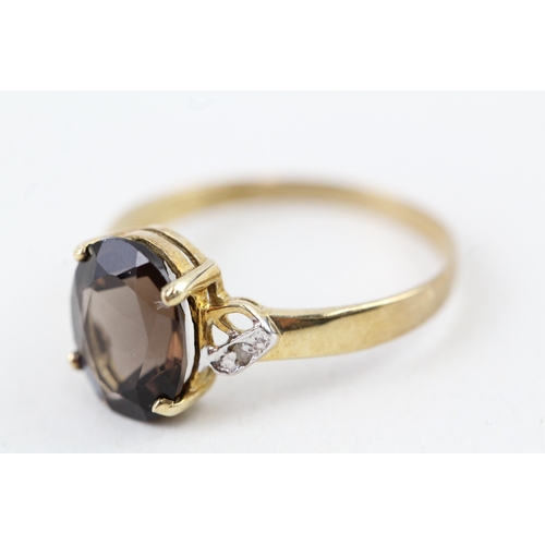 92 - 9ct gold oval cut smokey quartz & diamond dress ring (1.5g) Size  O