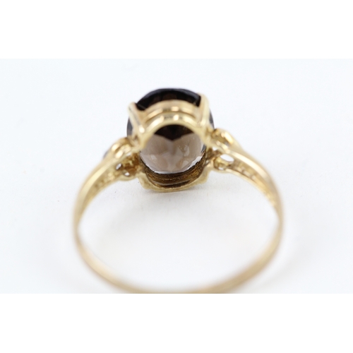 92 - 9ct gold oval cut smokey quartz & diamond dress ring (1.5g) Size  O