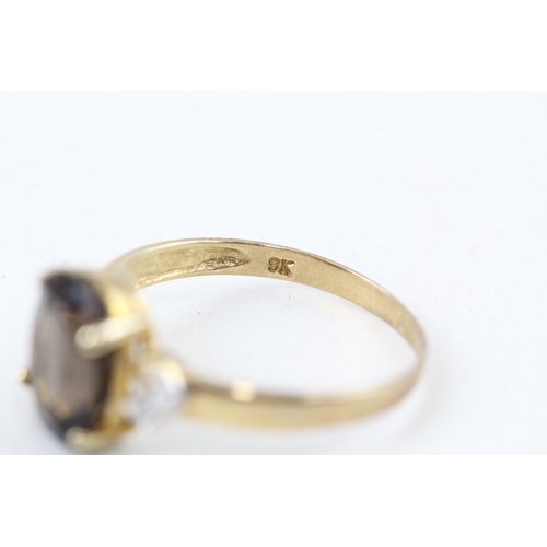 92 - 9ct gold oval cut smokey quartz & diamond dress ring (1.5g) Size  O