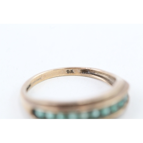 93 - 9ct gold emerald half eternity ring (2.4g) Size  O