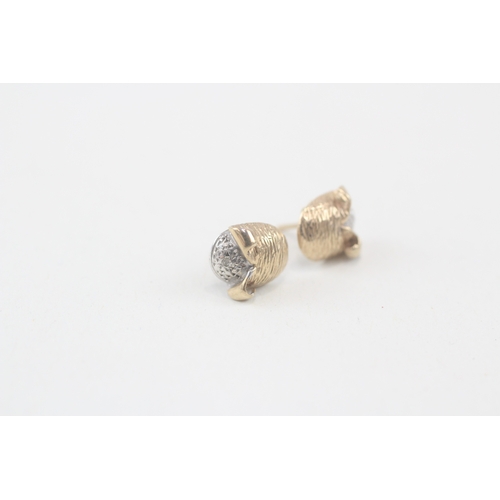 99 - 9ct gold diamond stud earrings with scroll backs (1.1g)