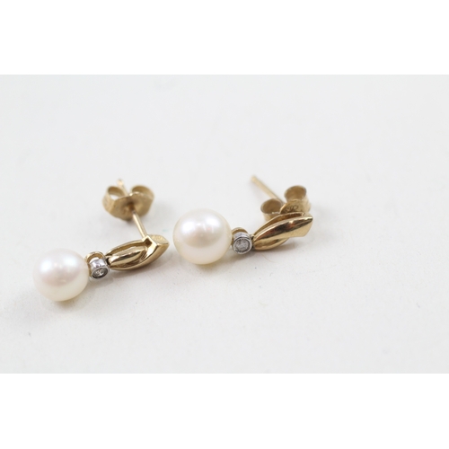 13 - 9ct gold cultured pearl and diamond stud earrings (1.7g)