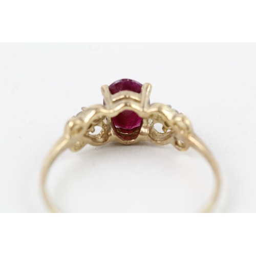 35 - 9ct gold ruby & diamond three stone ring with heart shape patterned shoulders (1.3g) Size  P