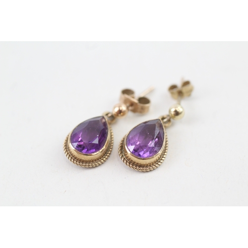 77 - 9ct gold pear cut amethyst drop earrings with scroll backs (2g)