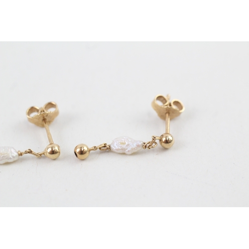 88 - 9ct gold rice pearl drop earrings with scroll backs (1.3g)