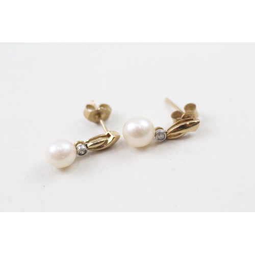 13 - 9ct gold cultured pearl and diamond stud earrings (1.7g)