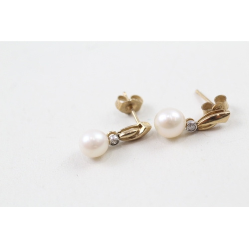 13 - 9ct gold cultured pearl and diamond stud earrings (1.7g)