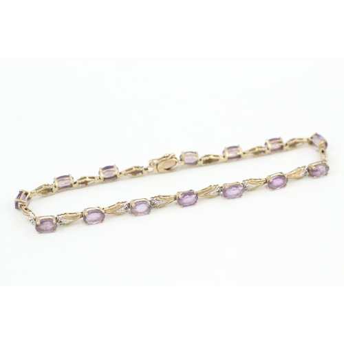 25 - 9ct gold oval cut amethyst & diamond bracelet (5.5g)