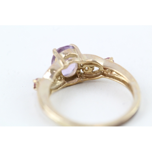 33 - 9ct gold oval cut amethyst & pink tourmaline ring with patterned shoulders (2.9g) Size  N 1/2