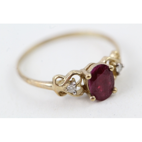 35 - 9ct gold ruby & diamond three stone ring with heart shape patterned shoulders (1.3g) Size  P