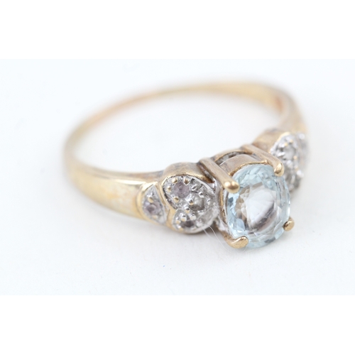 44 - 9ct gold oval cut aquamarine & white gemstone dress ring (3.6g) Size  U