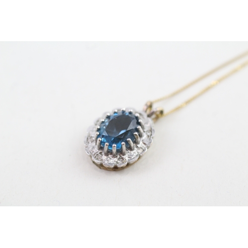 57 - 9ct gold oval cut blue topaz & diamond cluster pendant necklace (2.8g)