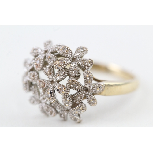 70 - 9ct gold diamond floral dress ring (3.6g) Size  T