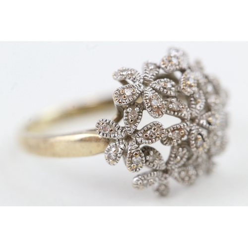 70 - 9ct gold diamond floral dress ring (3.6g) Size  T