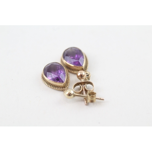 77 - 9ct gold pear cut amethyst drop earrings with scroll backs (2g)