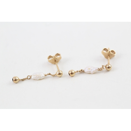 88 - 9ct gold rice pearl drop earrings with scroll backs (1.3g)