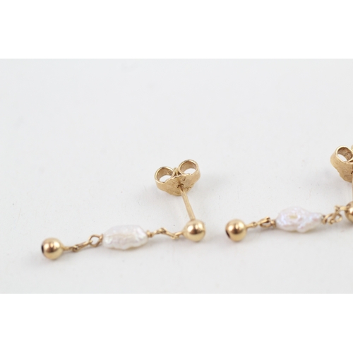 88 - 9ct gold rice pearl drop earrings with scroll backs (1.3g)