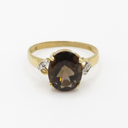 92 - 9ct gold oval cut smokey quartz & diamond dress ring (1.5g) Size  O