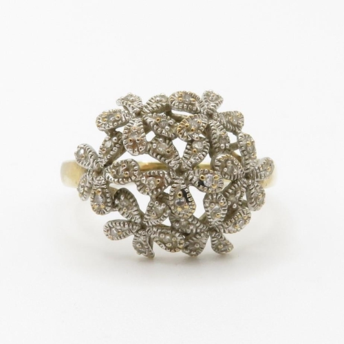 70 - 9ct gold diamond floral dress ring (3.6g) Size  T