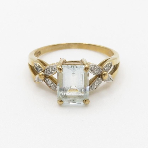 87 - 9ct gold emerald cut aquamarine & diamond dress ring (2.6g) Size  O