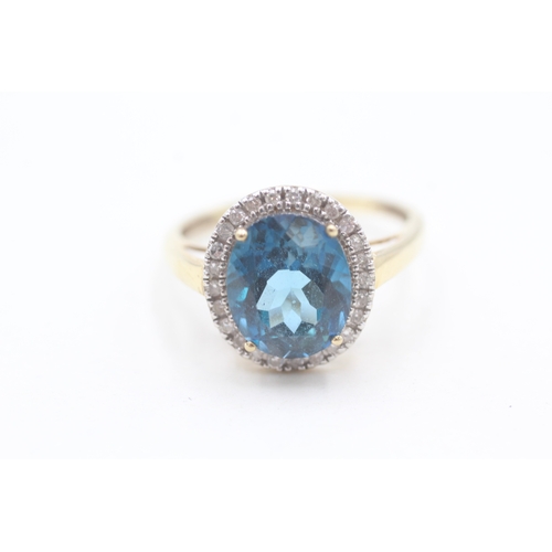 118 - 9ct gold diamond and blue topaz set cocktail ring (4g) Size  W