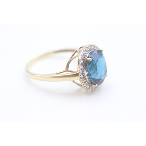 118 - 9ct gold diamond and blue topaz set cocktail ring (4g) Size  W