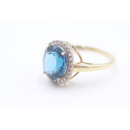 118 - 9ct gold diamond and blue topaz set cocktail ring (4g) Size  W