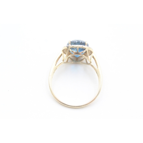 118 - 9ct gold diamond and blue topaz set cocktail ring (4g) Size  W