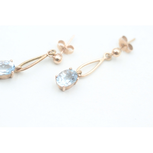 122 - 9ct rose gold oval cut aquamarine set drop earrings (1.8g)