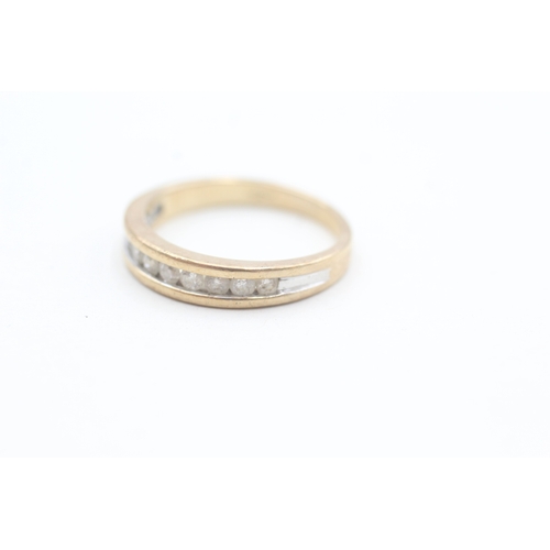 124 - 9ct gold channel set diamond eleven stone eternity ring (3.1g) Size  Q