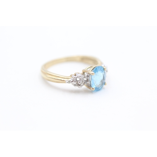 126 - 9ct gold diamond and blue topaz set dress ring (2.5g) Size  N