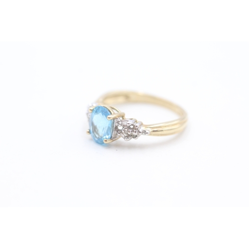 126 - 9ct gold diamond and blue topaz set dress ring (2.5g) Size  N