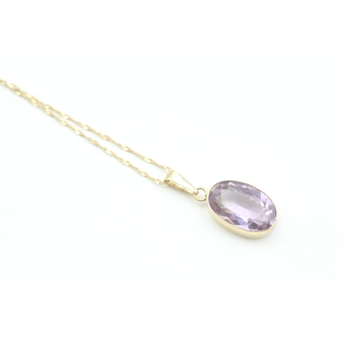 128 - 9ct gold vintage oval cut amethyst set pendant necklace (3.1g)