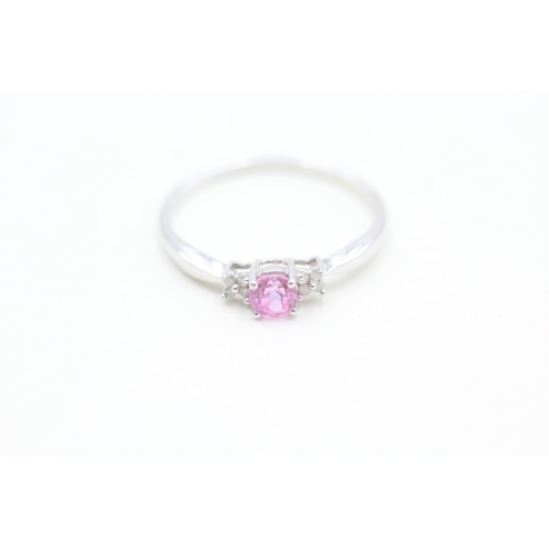 133 - 9ct white gold diamond and pink sapphire set dress ring (1.4g) Size  O