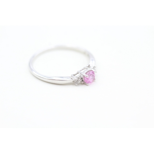 133 - 9ct white gold diamond and pink sapphire set dress ring (1.4g) Size  O