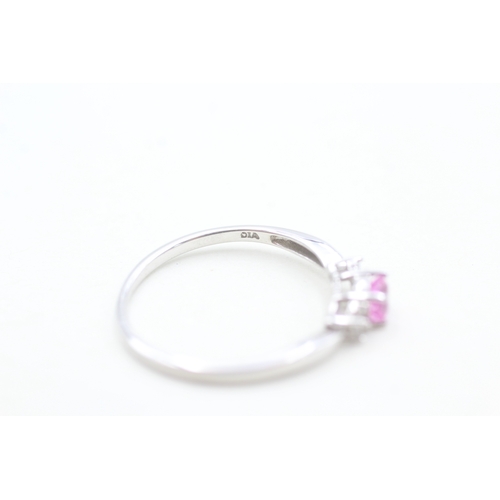 133 - 9ct white gold diamond and pink sapphire set dress ring (1.4g) Size  O